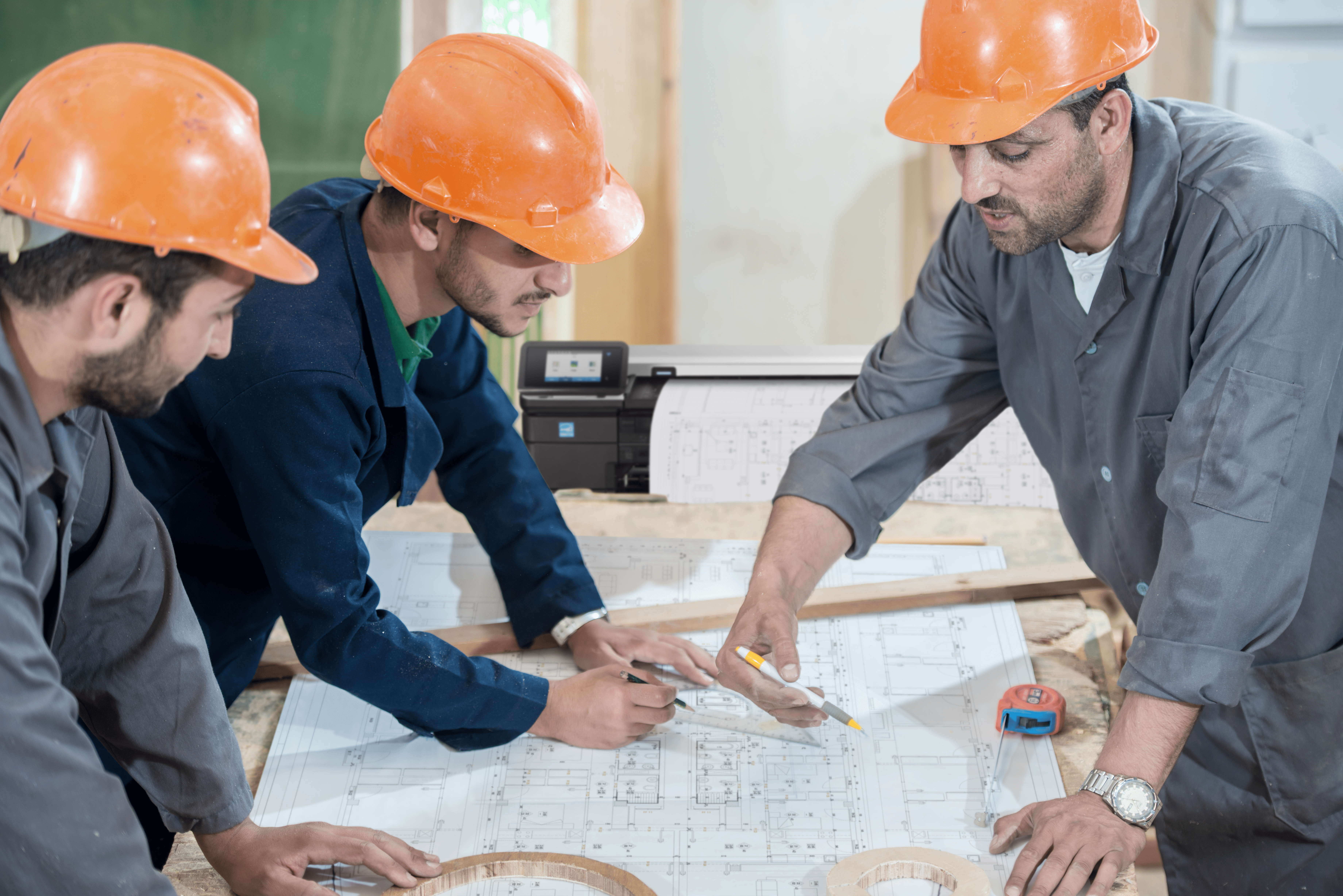 Architect reviewing A0 drawing